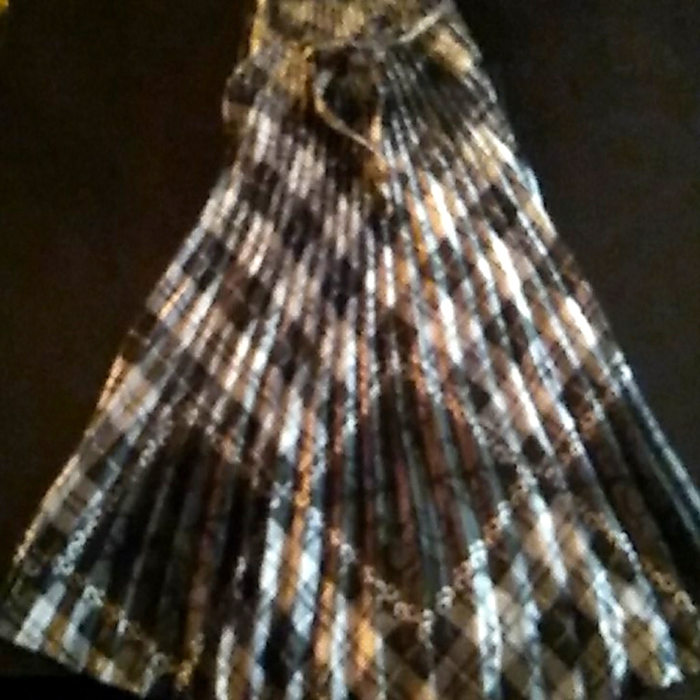 A pleaded black and white silk dress